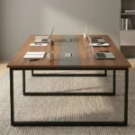 2.4 meters office boardroom table featuring a rich walnut wood laminate top, a central grey inset strip with pop-up power cable access modules, and sturdy black metal square loop legs.