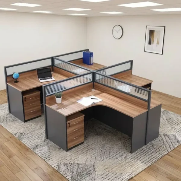 4-seater curved workstation featuring a quad L-shaped pod layout with teak wood-grain tabletops, dark grey side panels and modesty boards, semi-private divider screens with frosted slatted glass panels, and individual lockable under-desk mobile pedestal drawer units.
