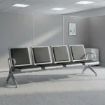 4-seater airport bench featuring four contoured seats with black padded faux leather cushions, silver powder-coated steel frames, curved metallic end armrests, and a heavy-duty beam structure supported by angled metal legs.