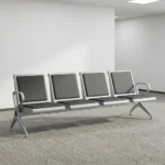 4-seater airport bench featuring four contoured seats with black padded faux leather cushions, silver powder-coated steel frames, curved metallic end armrests, and a heavy-duty beam structure supported by angled metal legs.