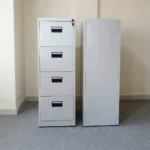 Vertical 4 drawer file cabinet featuring a tall steel structure in a powder-coated light grey finish, four full-extension filing drawers with integrated black recessed handles, individual label slots, and a top-right core lock system.