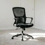 Secretarial mesh staff office chair featuring a breathable black mesh backrest with built-in spine-contoured lumbar support, a high-density padded fabric seat, fixed curved plastic armrests, a pneumatic height adjustment lever, and a five-star nylon swivel base with dual-wheel casters.