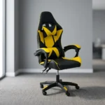 Ergonomic yellow gaming chair featuring high-density black and vibrant yellow faux leather upholstery with a geometric star/X pattern, a high-back racecar-style design, removable headrest cushion and lumbar pillow, padded link armrests, pneumatic tilt/height control levers, and a five-star nylon swivel base with color-accented caster wheels.
