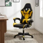 Ergonomic yellow gaming chair featuring high-density black and vibrant yellow faux leather upholstery with a geometric star/X pattern, a high-back racecar-style design, removable headrest cushion and lumbar pillow, padded link armrests, pneumatic tilt/height control levers, and a five-star nylon swivel base with color-accented caster wheels.