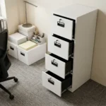 4 drawer cabinet featuring a clean white powder-coated steel finish, four vertical pull-out filing drawers on smooth ball-bearing glides, recessed black plastic handles, and individual key-lock mechanisms for each drawer.