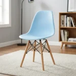 High quality Eames chair featuring a light blue molded polypropylene seat shell, natural solid wood dowel legs, and Eiffel-style black wire metal cross-bracing.