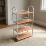 Free standing shoe rack featuring four light wood-grain open shelves, a white powder-coated tubular steel frame with arched side handles, wire side guardrails, and rear X-brace cross-support.