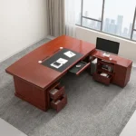 160cm executive office table featuring a rich mahogany wood finish, integrated black leatherette writing inlay, built-in cable management ports, decorative front modesty panel with geometric dark charcoal inlay and center diamond motif, and an L-shaped side return credenza with lockable storage drawers and open shelving.