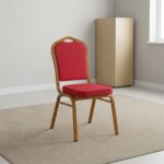 Stackable red conference chair featuring diamond-patterned bright red upholstered fabric with subtle white dot accents, a cushioned crown-back seat and backrest, top integrated handle grip, and a sturdy metallic gold-painted steel frame with non-marring floor glides.