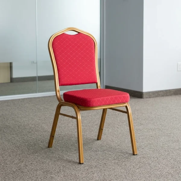 Stackable red conference chair featuring diamond-patterned bright red upholstered fabric with subtle white dot accents, a cushioned crown-back seat and backrest, top integrated handle grip, and a sturdy metallic gold-painted steel frame with non-marring floor glides.