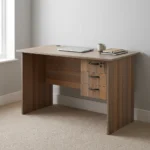 0.9m office study desk featuring a compact natural walnut wood-grain finish laminate desktop, built-in cable grommet, matching modesty panel, and an integrated right-side storage pedestal with three drawers, dark curved handles, and a top-drawer key lock.