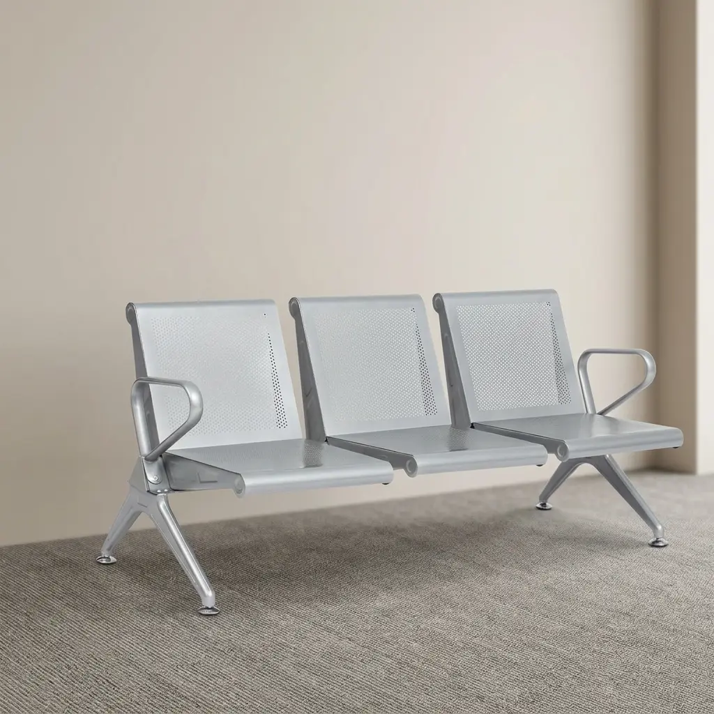 Heavy duty 3-seater waiting bench featuring three contoured, perforated metal seats in a sleek silver finish, an integrated beam frame with side armrests, and angled legs with leveling floor glides.