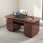 120cm executive office table featuring a rich mahogany wood-grain finish, an inlaid black leather writing pad, integrated cable management grommets, a pull-out keyboard tray, a left-hand three-drawer pedestal, a right-hand storage cabinet with crescent recessed handles, and a decorative black and mahogany diamond-pattern front modesty panel.