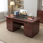 120cm executive office table featuring a rich mahogany wood-grain finish, an inlaid black leather writing pad, integrated cable management grommets, a pull-out keyboard tray, a left-hand three-drawer pedestal, a right-hand storage cabinet with crescent recessed handles, and a decorative black and mahogany diamond-pattern front modesty panel.