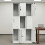 Metallic 9-locker file cabinet featuring a durable white powder-coated steel construction, nine individual key-lockable compartments arranged in a 3x3 grid, recessed vertical pull handles, card/label slot holders, and bottom ventilation louvers on each door for airflow.