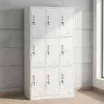Lockable 9-door steel locker cabinet featuring a durable white powder-coated metal frame, nine individual key-lockable compartments arranged in a 3x3 grid, embedded vertical pull handles, card/label slot holders, and bottom ventilation louvers on each door for airflow.