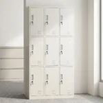 Metallic 9-locker file cabinet featuring a durable white powder-coated steel construction, nine individual key-lockable compartments arranged in a 3x3 grid, recessed vertical pull handles, card/label slot holders, and bottom ventilation louvers on each door for airflow.