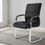 Black leather visitor seat featuring supple black leatherette upholstery with stitched paneling and plush padding, fixed armrests with black protective pads, and a polished chrome-finished cantilever sled base frame.