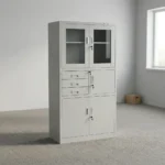 Steel cabinet with safe featuring a powder-coated light grey finish, a top double-door glass display cabinet with key lock, a middle section with three drawers alongside a locked safe compartment, and a bottom double steel-door storage locker with key lock.