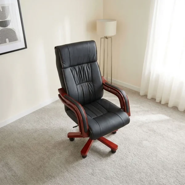 High back executive chair featuring premium black leatherette upholstery with stitched lumbar detailing, thick padding, rich mahogany-finished wooden armrests with metal accents, and a matching mahogany wooden five-star swivel base on smooth-rolling casters.