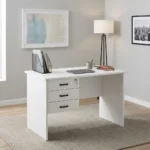 1.0m white home office table featuring a clean matte white laminate desktop, a circular cable management grommet, an integrated three-drawer fixed pedestal with black horizontal pull handles and a top-drawer key lock mechanism, a full-length white modesty panel, and sturdy engineered wood side panel legs.