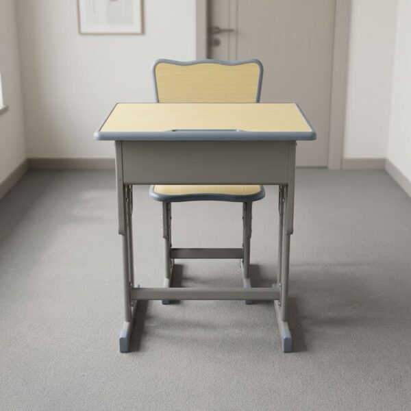 Adjustable kids study desk & chair featuring a light maple-finish laminate tabletop and matching chair seat and backrest, an integrated open storage cubby, a pencil groove tray, height-adjustable telescoping steel legs with pin locks, and a grey powder-coated steel frame with protective floor glides.