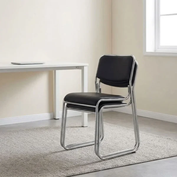 Stackable chrome guest chair featuring smooth black faux leather upholstery over a padded seat and backrest, an armless space-saving stackable design, and a tubular chrome cantilever sled base with protective floor glides.