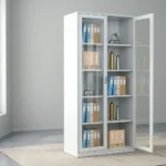 Steel full glass storage cabinet featuring a powder-coated white steel frame, dual full-length tempered glass hinged doors with recessed vertical pull handles and key lock system, four interior height-adjustable steel shelves creating five spacious storage tiers, and a flat reinforced floor-standing base.