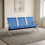 3-link blue steel waiting bench featuring three perforated blue powder-coated steel contoured seats, polished metal side armrests and trim edging, a heavy-duty black crossbeam support, and flared polished steel triangular legs with adjustable floor glides.
