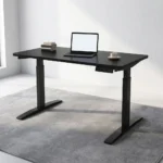 120cm black electric adjustable table featuring a smooth black laminate desktop, an under-desk digital smart control panel, a motor-driven motorized lifting system, and dual telescoping black powder-coated steel T-frame legs with low-profile flat feet.