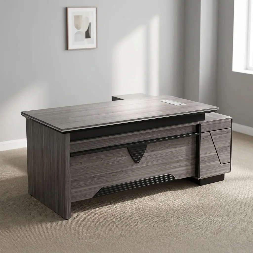 160cm office table with extension featuring a modern grey wood-grain laminate finish, an integrated desktop flip-top cable outlet box, a stylized front modesty panel with geometric black accent detailing, a side return extension unit with integrated drawer storage, and solid slab-style engineered wood panel legs.