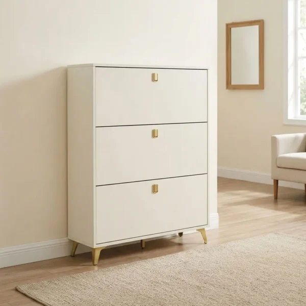 White wooden shoe rack featuring an off-white engineered wood frame, three pull-out tilt drawer compartments with brushed brass hardware handles, internal double-tier shoe organization racks, and tapered brushed brass corner leg supports.