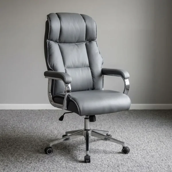 Gray managerial executive office seat featuring plush slate grey leatherette upholstery with segmented high-density padding and an integrated headrest cushion, contoured chrome fixed loop armrests with padded grey arm caps, a pneumatic height-adjustment lever with tilt-tension mechanism, and a polished chrome five-star swivel base on dual-wheel casters.