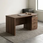 1.4m straight advanced table featuring a dark walnut wood-grain laminate finish, a circular cable management grommet on the tabletop, an integrated under-desk three-drawer lockable pedestal with curved black handles, a full modesty panel, and sturdy wooden side panel legs.