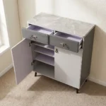 Modern bucket flip shoe rack featuring a faux grey marble top surface, two top grey lockable drawers with gold pull handles, lower dual white hinged doors opening to multi-tiered shoe storage shelves, and elevated dark tapered wooden legs.