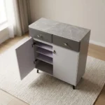 Modern bucket flip shoe rack featuring a faux grey marble top surface, two top grey lockable drawers with gold pull handles, lower dual white hinged doors opening to multi-tiered shoe storage shelves, and elevated dark tapered wooden legs.
