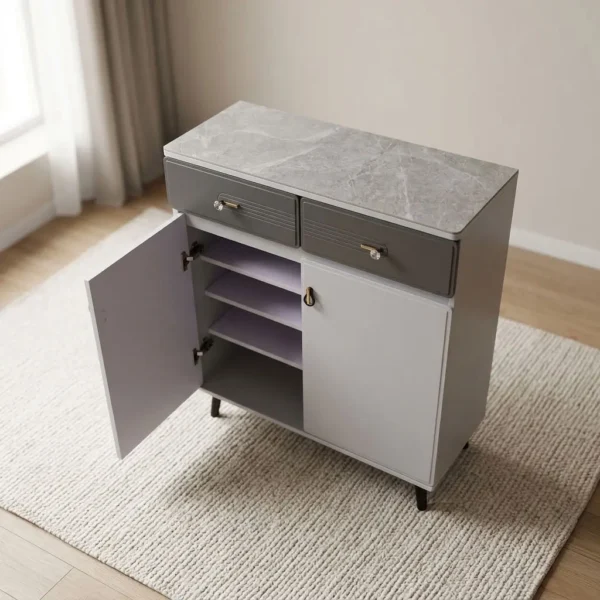 Modern bucket flip shoe rack featuring a faux grey marble top surface, two top grey lockable drawers with gold pull handles, lower dual white hinged doors opening to multi-tiered shoe storage shelves, and elevated dark tapered wooden legs.