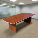 2.4 Metres wooden conference table featuring a rich reddish-brown teak wood-grain laminate tabletop with a distinct white edge trim accent, integrated dual wire management grommets, a full-length modesty support panel, and dual heavy-duty matching wooden slab base legs.