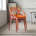 Outdoor stackable plastic chair featuring a weather-resistant molded polypropylene plastic body with an intricate interlocking loop backrest and integrated armrests, a contoured seat pan, and a space-saving stackable structure available in orange, white, and red finishes, supported by four integrated tapered legs with non-marking floor glides.