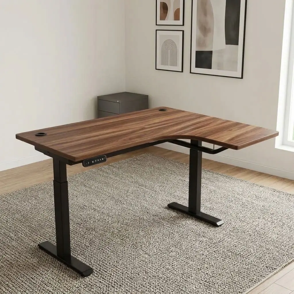 1.4m Curved Height adjustable table featuring an L-shaped curved walnut wood-grain laminate desktop with integrated dual cable pass-through grommets, an under-desk digital LED control handset with height memory presets, motorized sit-stand height adjustment mechanisms, and a heavy-duty black powder-coated steel dual-leg frame with T-style support bases.