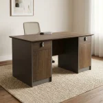 Rectangular 1.2m office table featuring a walnut wood-grain laminate desktop with a central flip-top cable outlet box, twin pedestal side cabinets with grey-framed top drawers and lower storage doors, and a full modesty panel floor-standing pedestal base.