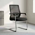 Mid-back cantilever waiting chair featuring a breathable black mesh mid-back rest with an integrated geometric pattern lumbar support band, a cushioned black fabric seat, fixed T-shaped armrests with black arm pads, and a continuous tubular chrome cantilever frame base with protective floor glides.