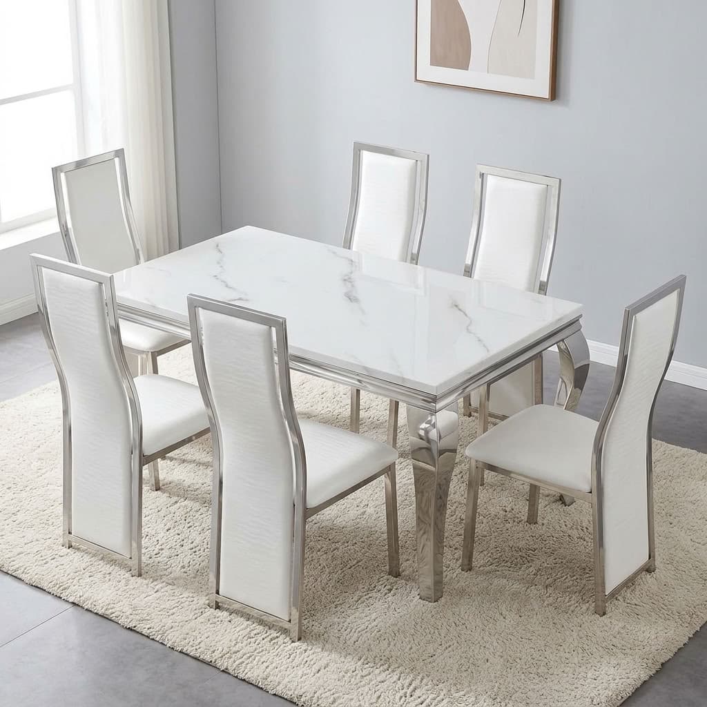 White marble dining set featuring a rectangular white faux-marble tabletop with a polished silver stainless steel frame and apron trim, six matching high-back dining chairs with white faux leather upholstery, and polished silver stainless steel curved cabriole legs.