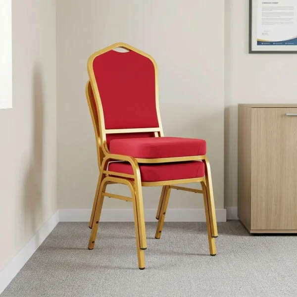 Heavy duty red conference chair featuring a crown-back design with red fabric upholstered backrest and a thick cushioned seat pan, a stackable armless frame structure, and a gold powder-coated square steel tube four-leg base equipped with protective bumpers and non-marring floor glides.