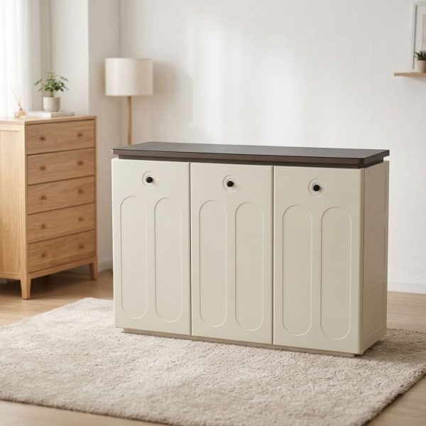 3 door modern shoe rack featuring a dark walnut wood laminate top surface, cream-white composite cabinet doors with arched recessed panel details, three front-opening cabinet doors with circular ventilation cutouts, and a low-profile floor-standing plinth base.