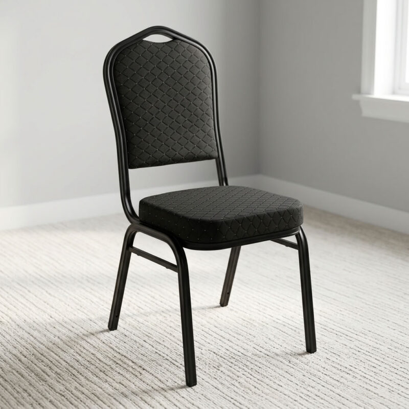 Stackable black fabric event chair featuring diamond-quilted black fabric upholstery with subtle flecked pattern details, a high-density padded crown-back backrest with integrated top handhold cut-out and thick cushioned seat, armless space-saving configuration, stackable design with side frame bumpers, and a heavy-duty black powder-coated tubular steel four-legged frame equipped with protective floor glides. Stackable black fabric event chair featuring diamond-quilted black fabric upholstery with subtle flecked pattern details, a high-density padded crown-back backrest with integrated top handhold cut-out and thick cushioned seat, armless space-saving configuration, stackable design with side frame bumpers, and a heavy-duty black powder-coated tubular steel four-legged frame equipped with protective floor glides.