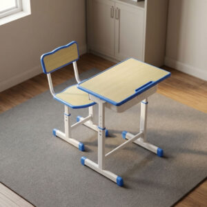 download - 2026-10-29T113508.252 Kids school study set featuring a light wood laminate desktop and matching chair seat/backrest panels with blue protective edge banding, an under-desk pull-out book storage drawer, height-adjustable telescopic legs with pin-locking security adjustments, and a white powder-coated steel frame with blue floor-protective end caps.