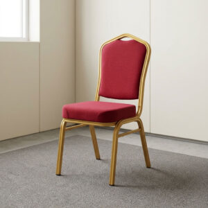 Red fabric stackable event chair featuring rich crimson red fabric upholstery, a high-density padded crown-back backrest with integrated top handhold cut-out and thick cushioned seat, armless space-saving stackable design with frame bumper guards, and a heavy-duty metallic gold powder-coated tubular steel four-legged frame equipped with protective floor glides. Red fabric stackable event chair featuring rich crimson red fabric upholstery, a high-density padded crown-back backrest with integrated top handhold cut-out and thick cushioned seat, armless space-saving stackable design with frame bumper guards, and a heavy-duty metallic gold powder-coated tubular steel four-legged frame equipped with protective floor glides.