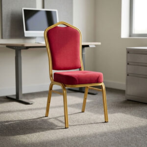 Red fabric stackable event chair featuring rich crimson red fabric upholstery, a high-density padded crown-back backrest with integrated top handhold cut-out and thick cushioned seat, armless space-saving stackable design with frame bumper guards, and a heavy-duty metallic gold powder-coated tubular steel four-legged frame equipped with protective floor glides. Red fabric stackable event chair featuring rich crimson red fabric upholstery, a high-density padded crown-back backrest with integrated top handhold cut-out and thick cushioned seat, armless space-saving stackable design with frame bumper guards, and a heavy-duty metallic gold powder-coated tubular steel four-legged frame equipped with protective floor glides.