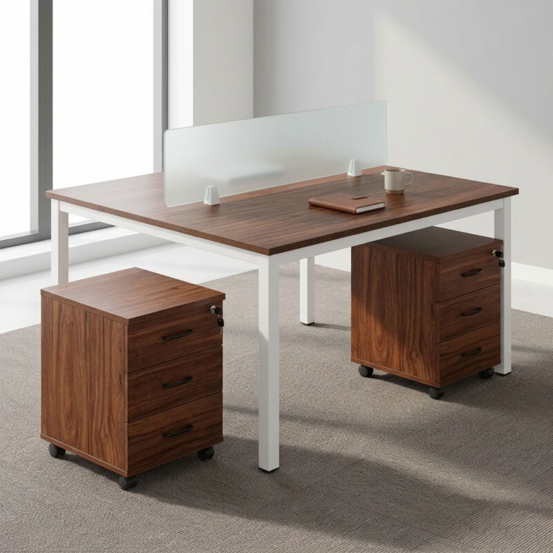 2-way open workstation featuring twin back-to-back dark walnut wood grain laminate desktops separated by a central translucent frosted glass privacy divider screen, two mobile lockable three-drawer storage pedestals with black curved handles, integrated desktop cable grommets, and a sturdy white powder-coated steel loop-leg frame equipped with floor-protective glides.